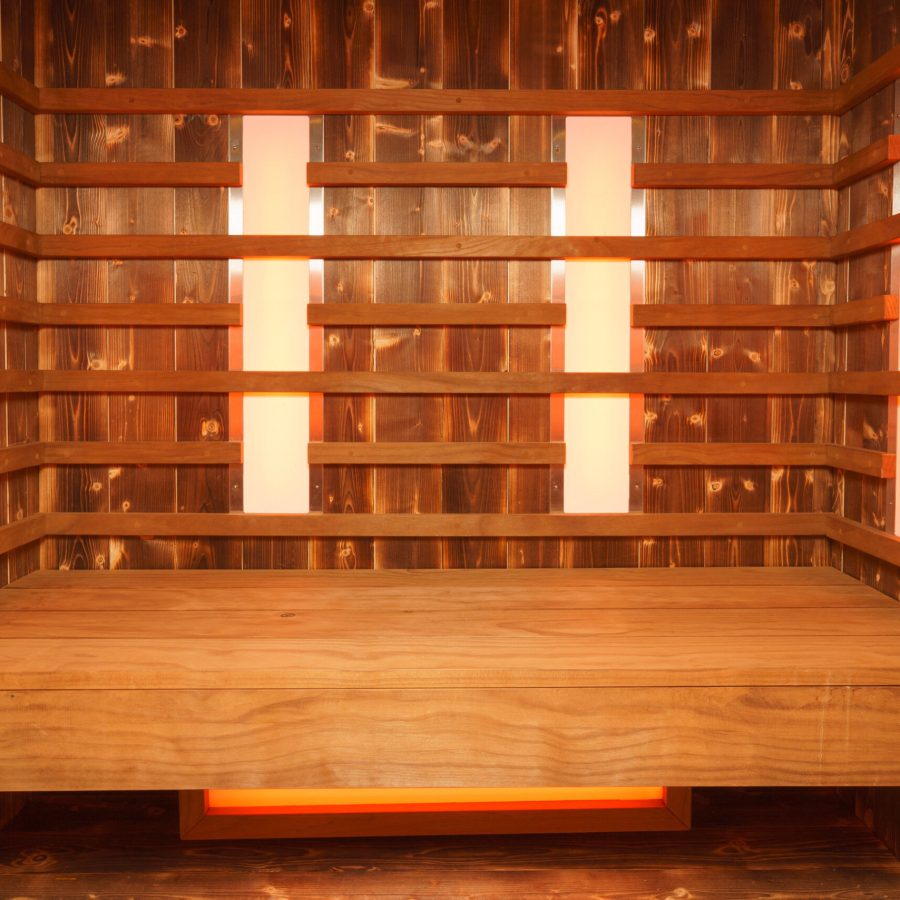 An interior of an empty wooden steam room